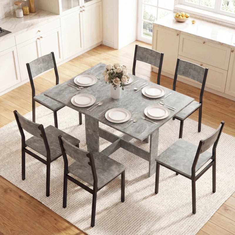 Grey fully unfolded drop-leaf dining table with set dinner plates