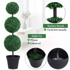 Artificial plant in black pot with three stacked green pom-pom foliage