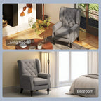 Dark grey wingback armchair with tufted back, rolled arms, and black turned legs