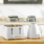 White electric kettle and four-slice toaster set on a countertop
