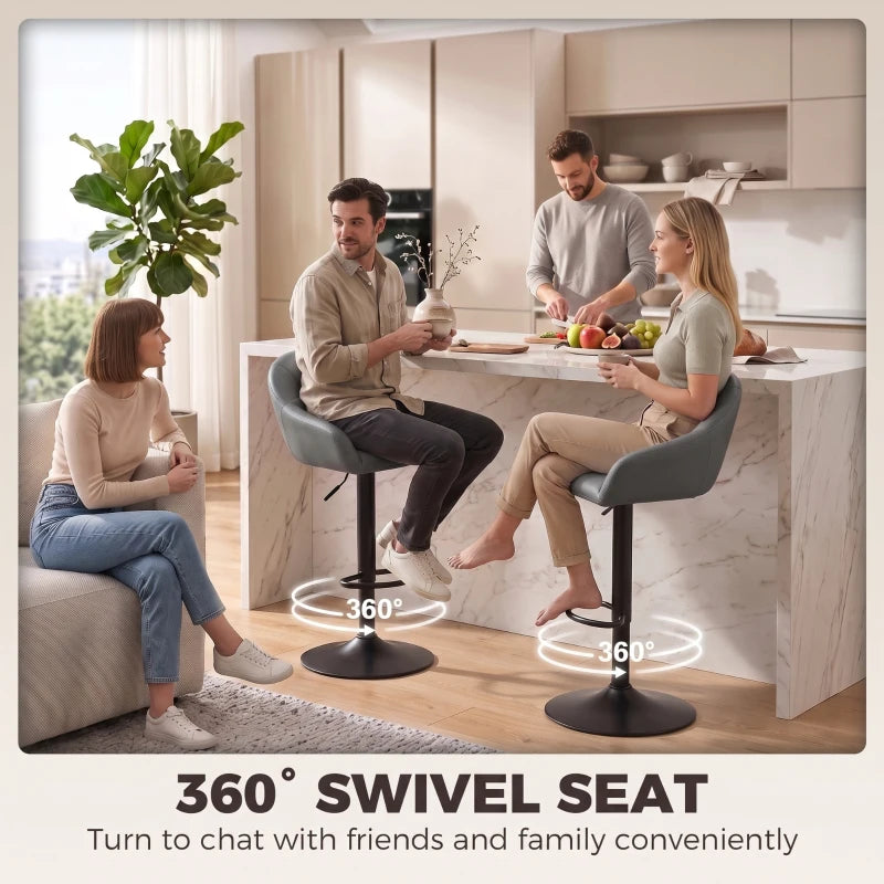 Two grey bar stools with swivel bases, padded seats, curved backrests, and armrests
