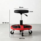 Black padded height-adjustable rolling stool with red circular tray and caster wheels