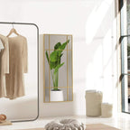 Gold-tone grid wall mirror with rectangular frame and reflective glass panes.