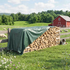 Green waterproof tarpaulin cover over stacked firewood, secured with corner eyelets