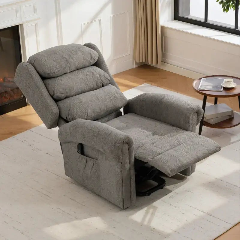 Dark grey power lift recliner chair with open base and extended footrest