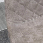 Grey quilted microfiber upholstery with stitched diamond pattern on bar stool seat