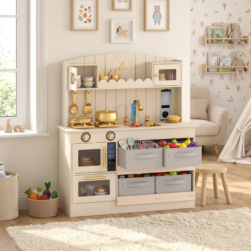Cream kids play kitchen with lower cabinet drawers, oven doors, and full counter accessories