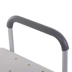 Gray padded armrest handle on a white shower transfer bench