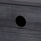 Round cable management hole on glossy black cabinet surface