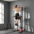 Pull-up power tower with cable lat station and black/red frame, for home workouts.