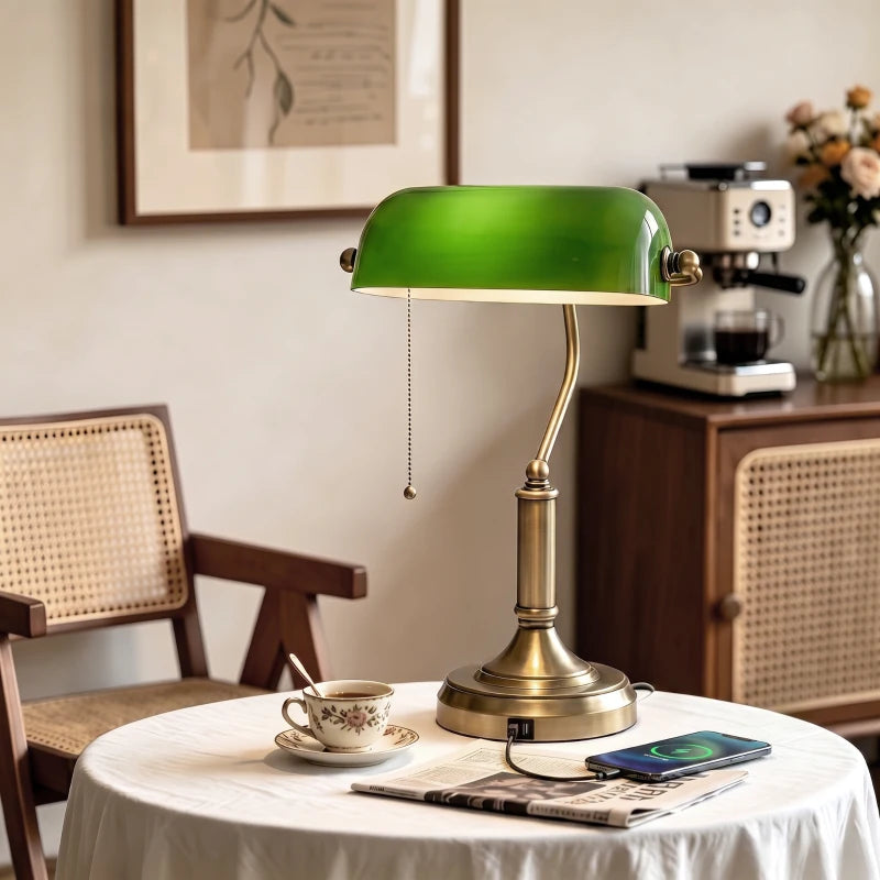 Green glass desk lamp with bronze base and pull-cord chain on stem