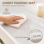 Waterproof changing pad mat with soft, wipe-clean surface and 2.5 cm thick padding.