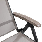 Close-up of folding joint and brown armrest on grey mesh sun lounger