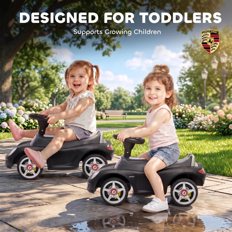 Matte black ride-on push car with seat and steering wheel, front profile view