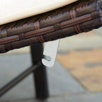 Close-up of dark brown rattan weave on sun lounger frame with metal leg