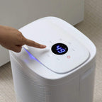 White dehumidifier top control panel with digital display and blue light