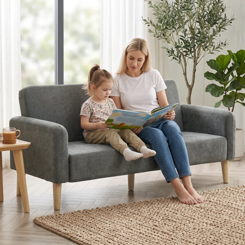 Grey velvet 2-seater sofa with wide seating and plush cushions for two