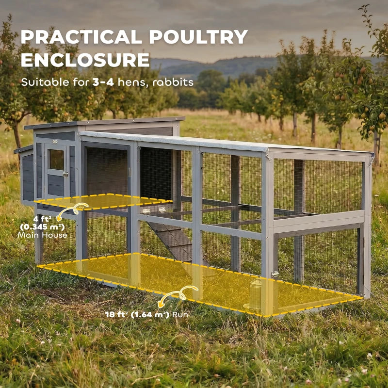 Grey wooden chicken coop with covered run and wire mesh sides, hens inside