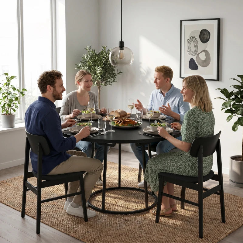 Round black dining table with conical metal base for family meals