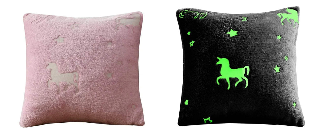 Kids unicorn fleece pillows: one pink, one dark with green unicorn and star print.