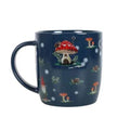 Dark blue ceramic mug with gnome mushroom and moon print, snow dot pattern.