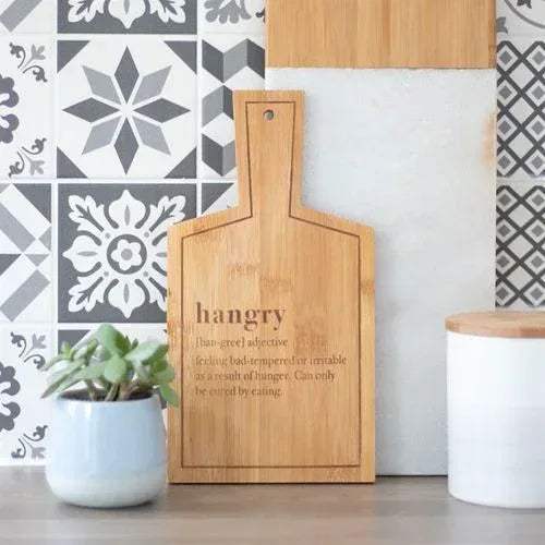 Bamboo serving board with hanging hole and engraved quote on front