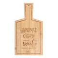 Bamboo serving board with handle and engraved “Grandma’s Kitchen Sweet” message.