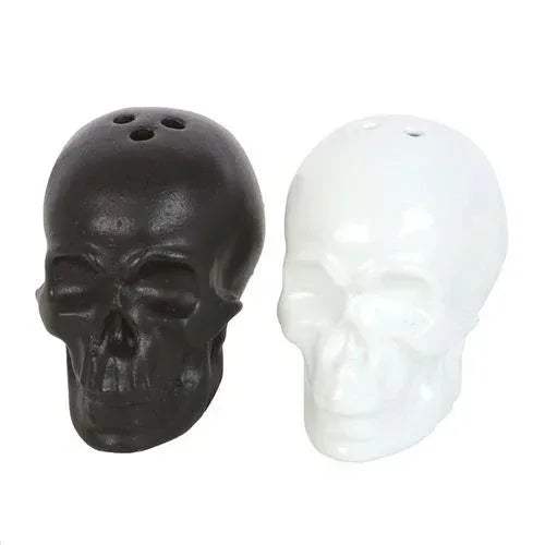 Skull-shaped salt and pepper shakers: dark and white skull heads with holes