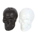 Skull-shaped salt and pepper shakers: dark and white skull heads with holes