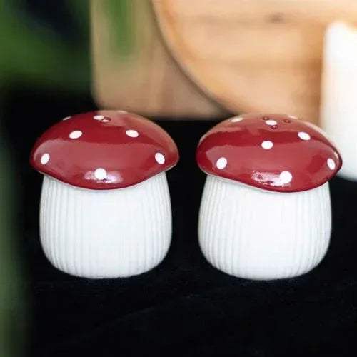 Mushroom salt and pepper shakers: red polka-dot caps, white ribbed bodies