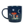 Dark blue ceramic mug with gnome and toadstool night sky graphic, curved handle