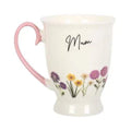 Off-white pedestal mug with pink handle, script “Mum” and wildflower bouquet print