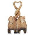 Elephant family figurine, standing elephant with curled trunk and heart-shaped loop