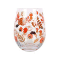 Stemless glass with orange and brown autumn leaves, pumpkins, and acorns
