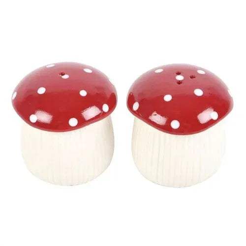 Pair of mushroom salt and pepper shakers, red polka-dot caps on white ribbed stems
