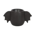 Black bat-wing egg cup with side wings around the open bowl