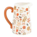 Ceramic flower jug with orange handle, white body, autumn leaves and pumpkins pattern