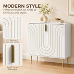 White cabinet with embossed curved gold lines, gold handle pulls, and metal legs