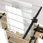 Close-up of black side wing with clip bars on a four-tier drying rack frame