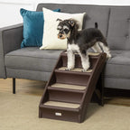 Brown four-step pet stairs with beige non-slip treads, small dog standing on top step