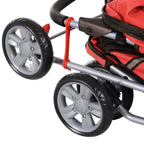 Red pet stroller wheel close-up with gray frame and black tire tread