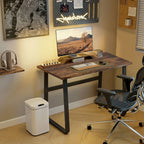 Industrial writing desk in home office with brown top and black metal frame
