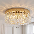 Gold-tone crystal ceiling chandelier with tiered clear prisms and bright light