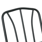 Close-up of dark metal armchair back frame with curved top