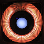 Black patio heater close-up with glowing halogen ring and blue LED indicator