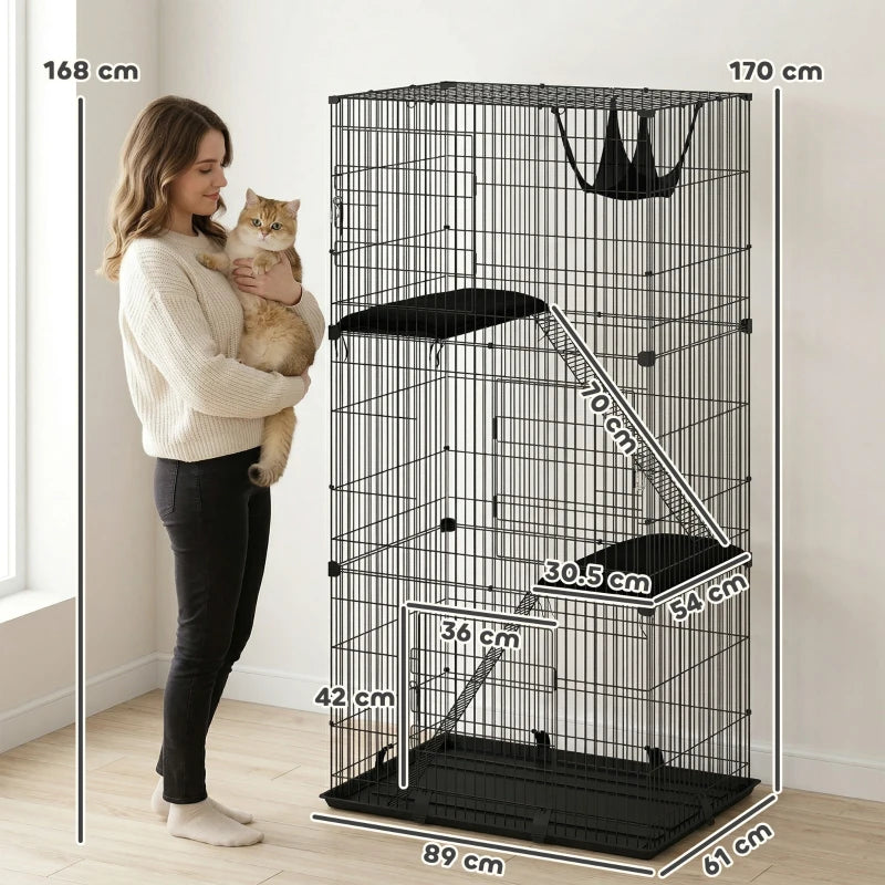 Black 3-tier cat cage with ladder and platforms, shown with a person for scale