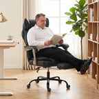 Black reclining office chair with wide seat and tall backrest, shown in use