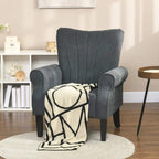 Grey upholstered armchair with rolled arms and tall back