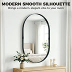 Black oval wall mirror with smooth rounded frame and reflective surface