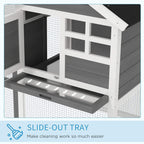 Grey wooden small animal hutch with wire mesh panels and slide-out cleaning tray